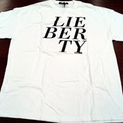 White t-shirt with black letters reading Lie Ber Ty