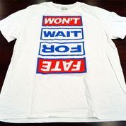 White t-shirt with blue and red lettering reading Won't wait for fate